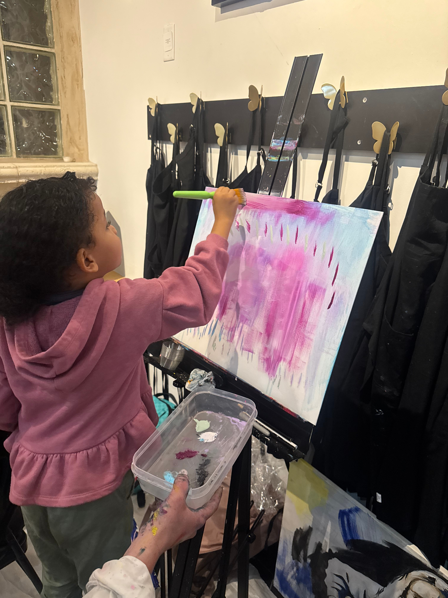 Amillie focused on her canvas